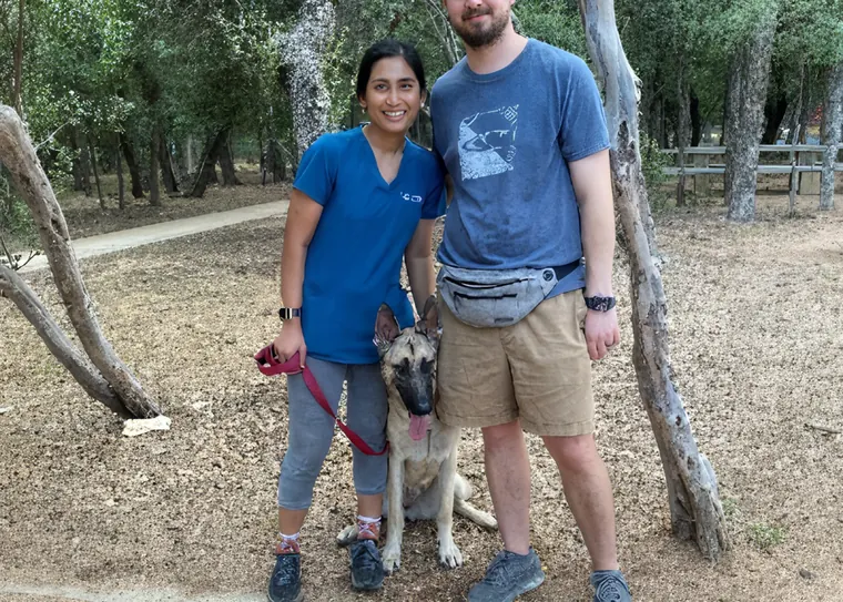 Owners out in public with their trained dog